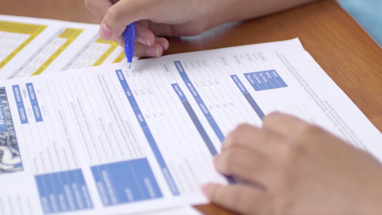 A focused individual meticulously filling documents an office environment for effective task management