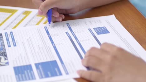 a focused individual meticulously filling documents an office environment for effective task management