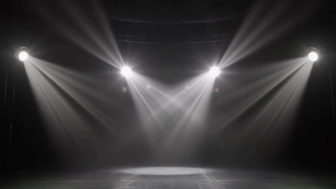 Bright Stage Spotlights Shining Down on Empty Performance Floor