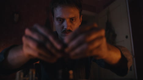 man engaged in a mysterious candlelit ritual
