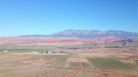 vista of plains and mountains near countryside city of hurricane in washington county, utah, united states