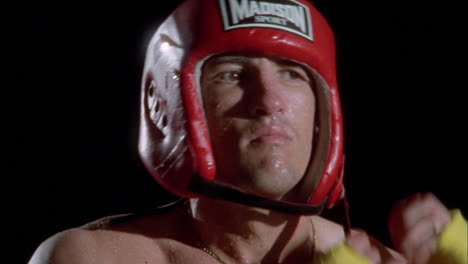 a boxer puts on his head gear