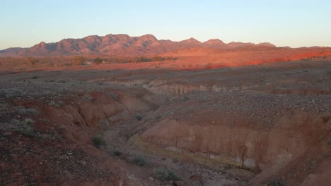 Aerial-flying-low-over-dried-creek-bed,-idyllic-Landscape-of-Wilpena-Pound,-Australia