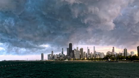 time lapse of storm clouds building above skyline of chicago, windy evening