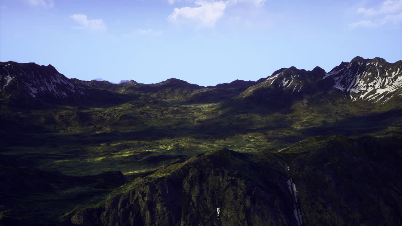 Mountain landscape with lush greenery and shadows during daylight hours