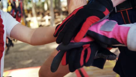 trainer and kids performing a hand stack 4k