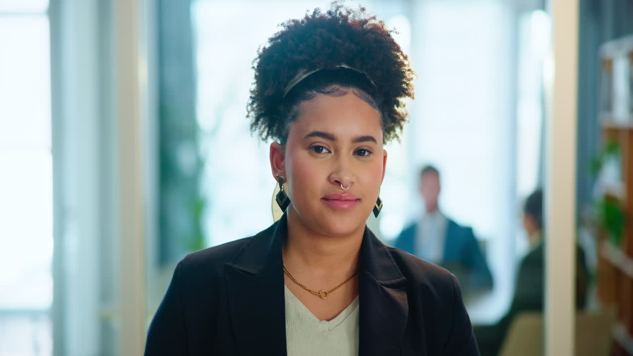 A portrait of a smiling woman in a blazer