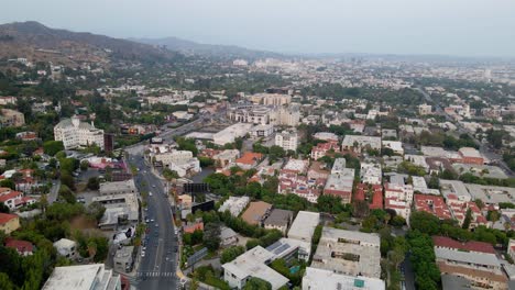 aerial view of traffic and buildings in west hollywood - circling, drone shot