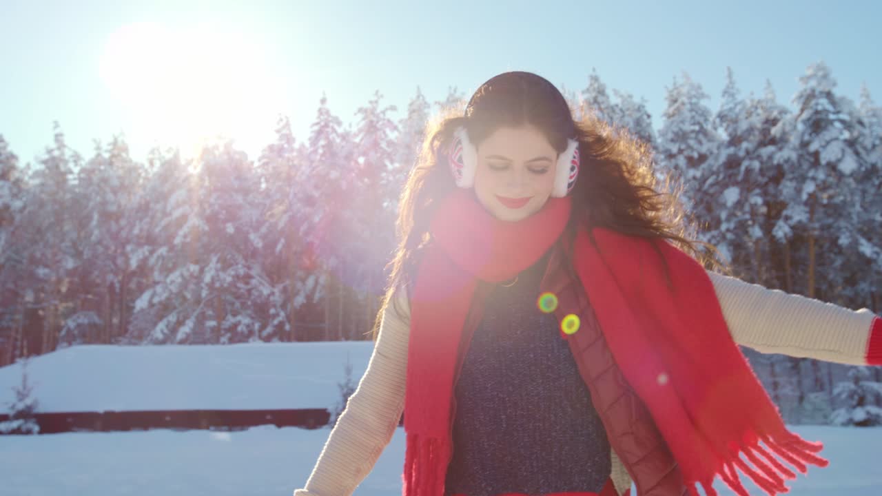 Woman enjoying a winter day in the snow