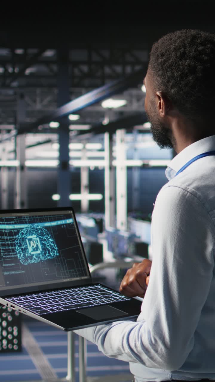 Vertical video Programmer and colleague in data center reviewing AI LLM visualizations