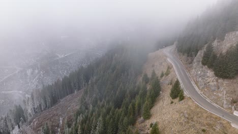 Cinematic-Shot-In-Foggy-Weather-Of-Rural-Road-In-Heart-Of-Bucegi-Mountains,-Romania