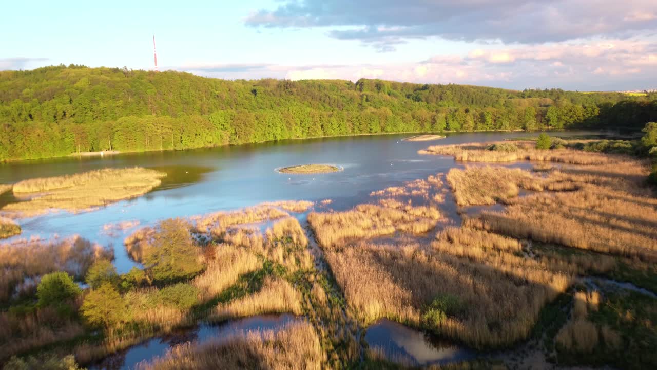 Sunset over a tranquil lake and marshland