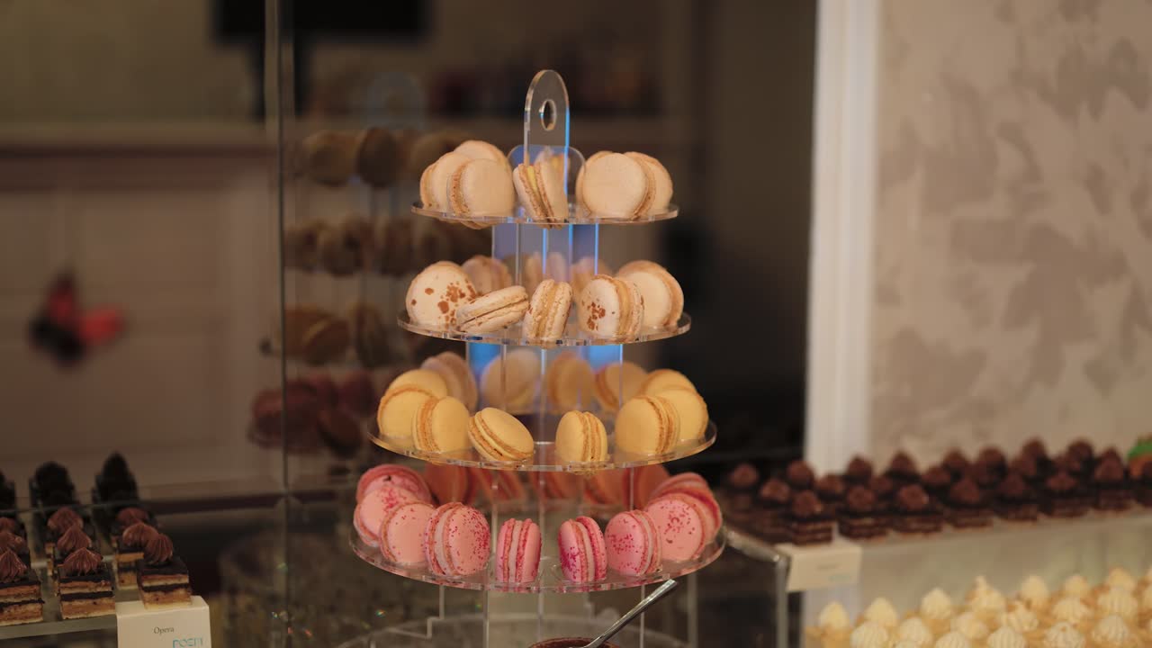 Elegant small arrangement of macaroons in white, yellow, and pink colors