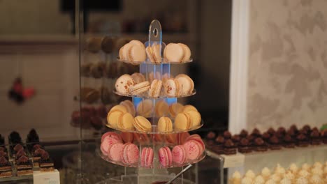 elegant small arrangement of macaroons in white, yellow, and pink colors