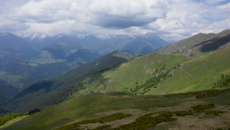 wide cinematic drone shot of the caucasus mountains in tusheti georgia