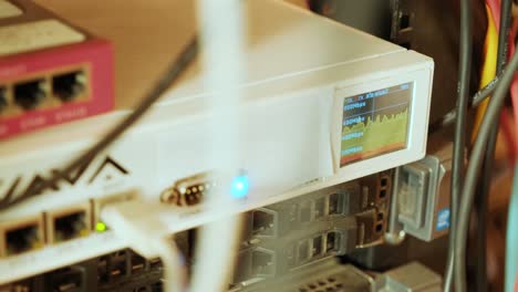 network switch and ethernet cable in rack cabinet. network connection technology and has a status led to show working status. concept of infrastructure with cables connected to data center