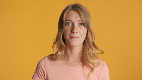 Upset-Caucasian-woman-with-tongue-out-on-camera.