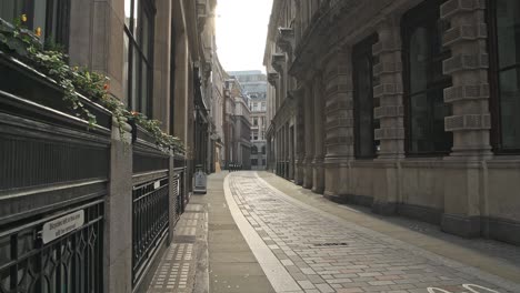 empty roads and quiet streets with almost no people and no traffic during the coronavirus pandemic covid-19 lockdown, taken at rush hour at bank in the city of london, england, europe