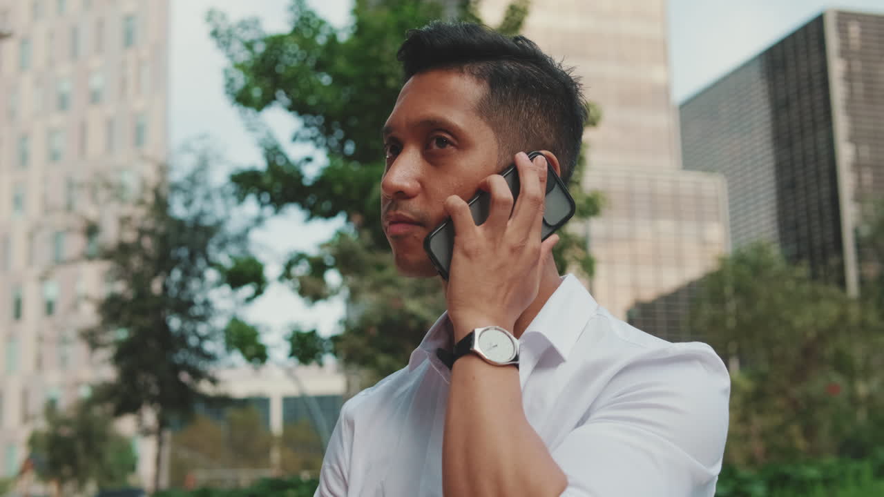 Man talking on phone in the city