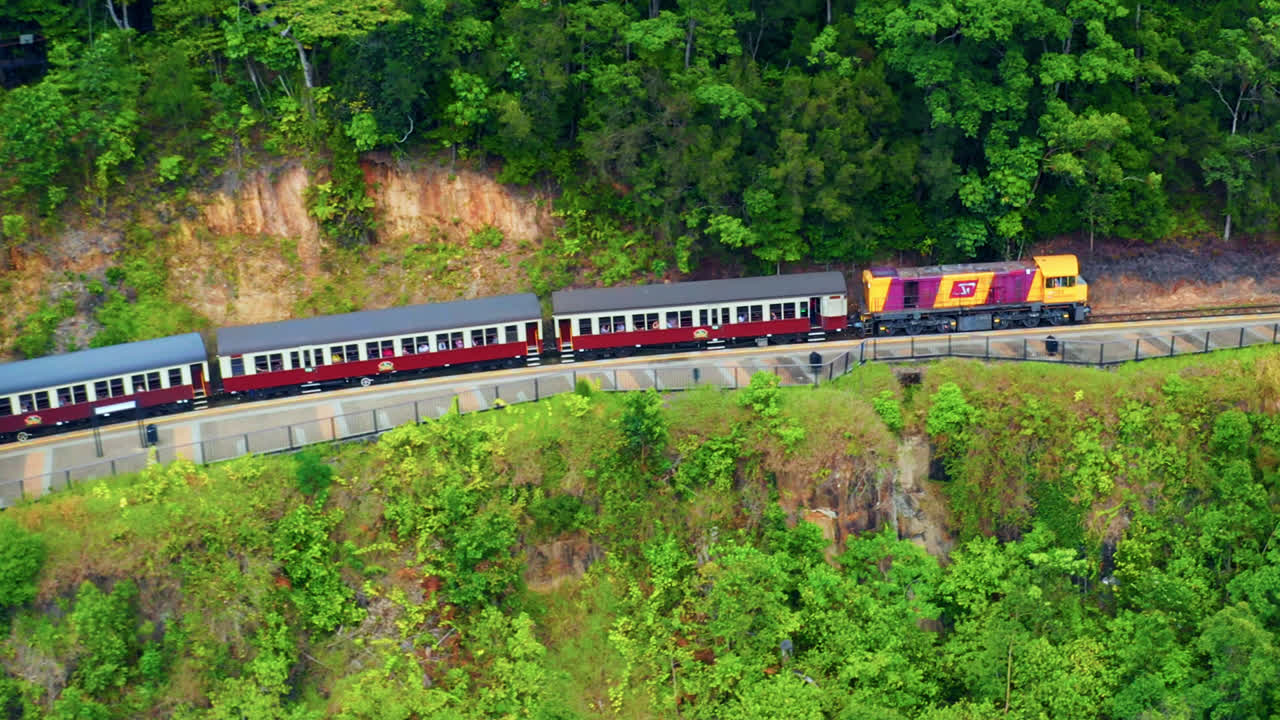 Kuranda Scenic Railway At Red Bluff Cairns North Queensland Australia - aerial drone shot