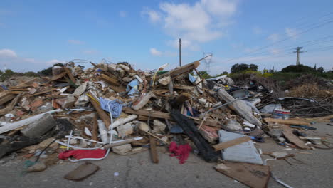 big pile of trashes uncontrolled landfill along a road france aix en provence