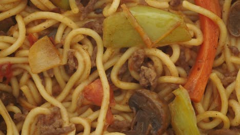 close-up of spaghetti with ground beef and vegetables