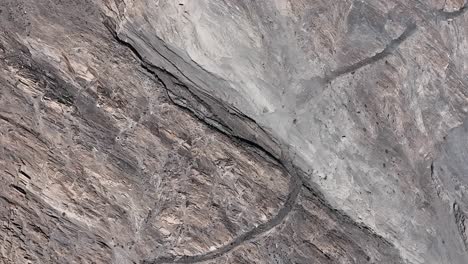 aerial birds eye view of old silk road route across remote valley region in pakistan