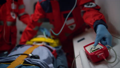 Medical-assistants-checking-oxygen-blood-level-of-victim