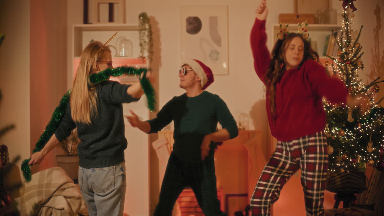 Man and women having fun while dancing at home