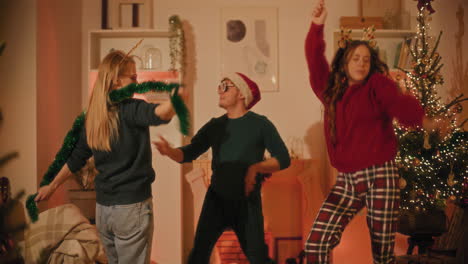 man and women having fun while dancing at home