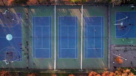 static overhead view of a group of people playing tennis at parque araucano, las condes, santiago, chile