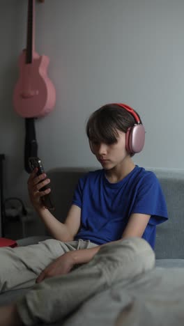 teenager listening to music on phone