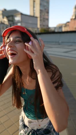 teenage girl enjoying music on rooftop