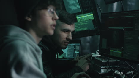 two hackers discussing code