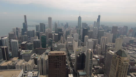 Vista-Aérea,-Rascacielos,-Panorama-De-Edificios-Altos,-Centro-De-La-Ciudad,-Ciudad-De-Chicago,-Estados-Unidos,-Paisaje-Urbano,-Vista-Superior-En-La-Parte-Superior-De-La-Torre-Hancock,-Cielo,-Río,-El-área-Del-Bucle