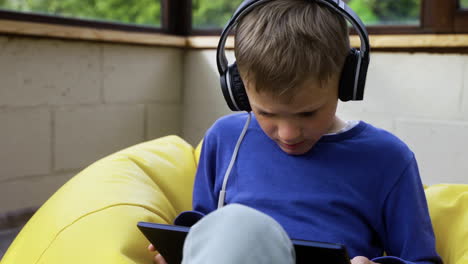 kid sitting on hassock