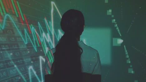 Woman-Visiting-Immersive-Art-Exhibition-With-Projection-Of-Financial-Data-With-Graphs-And-Share-Prices-11