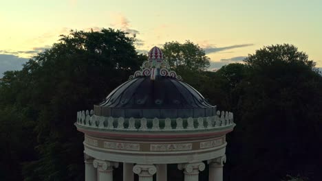 sunset cityscape with park and ornate dome