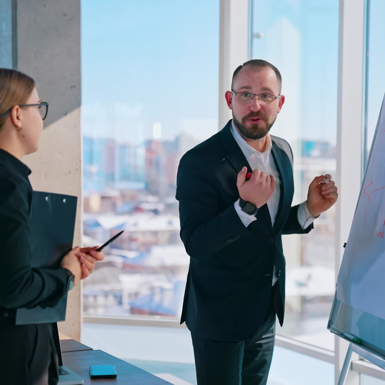 Business people work on new project indoors. Entrepreneurs man and woman in office on city window background in a bright day