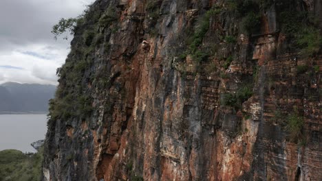 woman rock climbing shuanglang dali beautiful rock face, china tourism