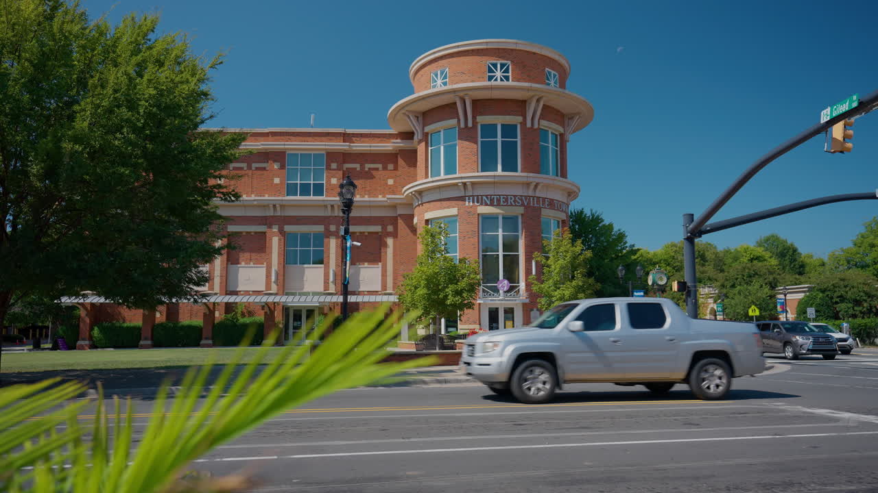 Camera Truck Right Revealing Red Brick Building in Huntersville, North Carolina