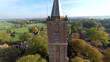 drone flying away from church clock