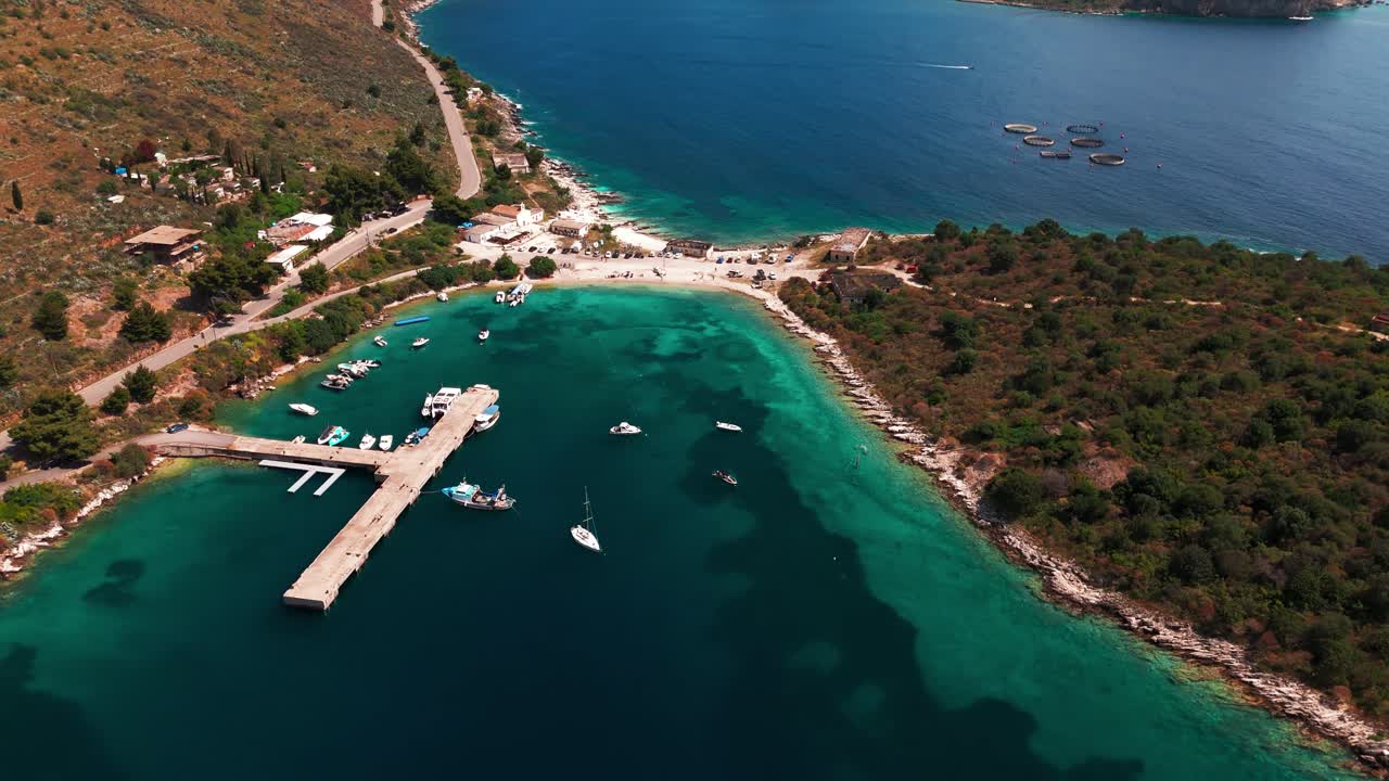 Aerial clip near Ksamil, Albania with blue sea, white beaches, small islands and scenic harbor