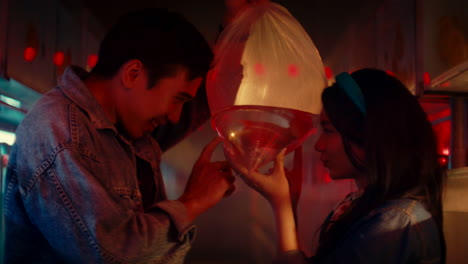 young couple with fish bag