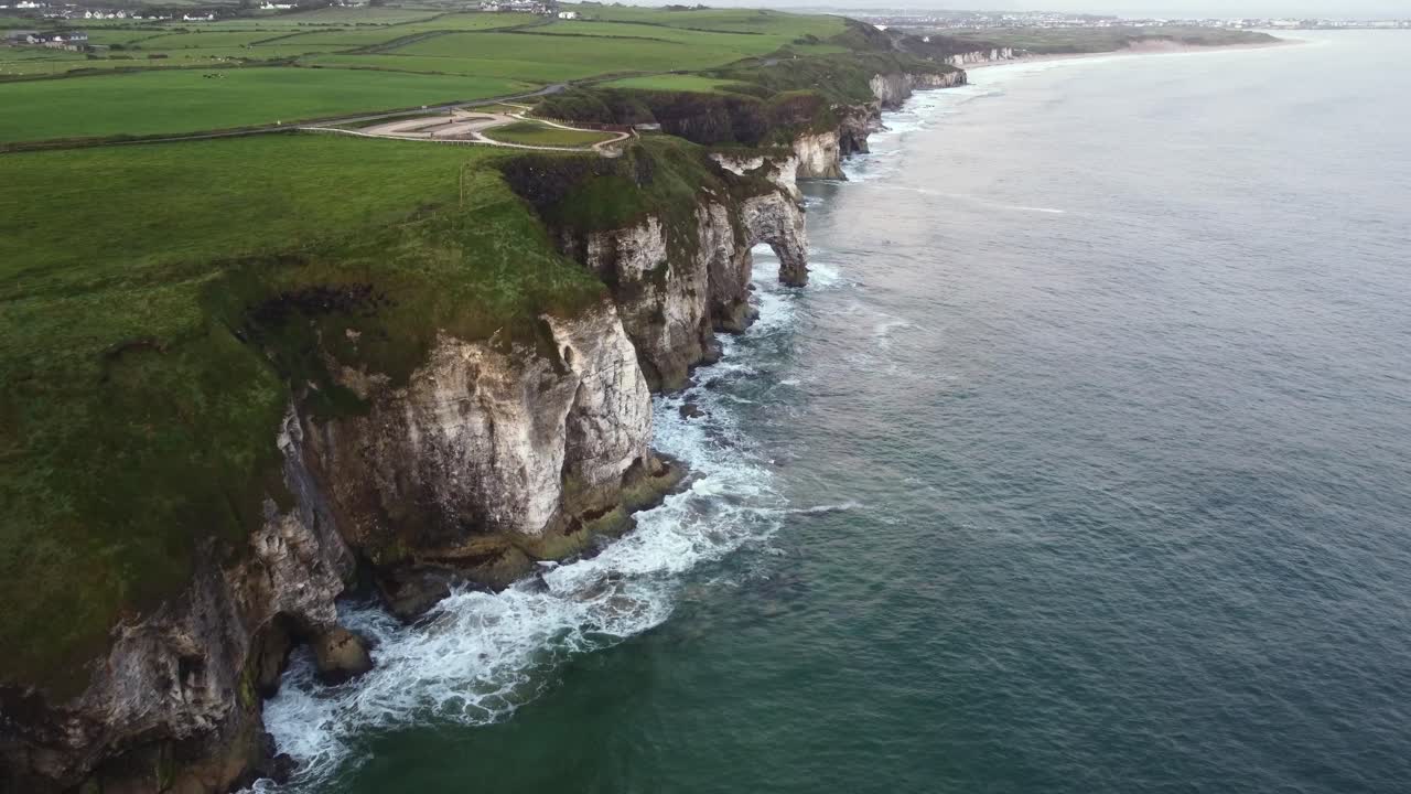 Aerial view of the rugged coastline looking towards Portrush with Magheracross Viewpoint in the foreground, County Antrim, Northern Ireland