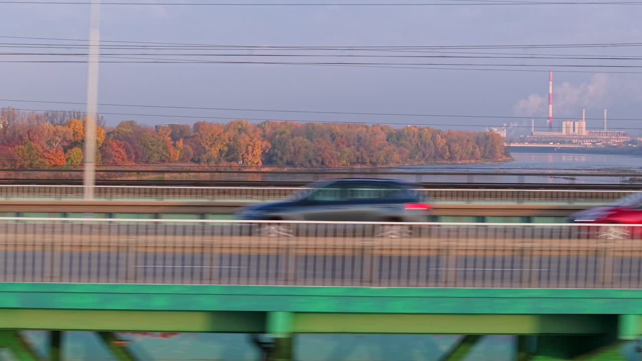 Warsaw, Poland. Drone Shot of Buzzing Bridge Traffic, Cars and Vehicles Moving Fast on Sunny Autumn Day