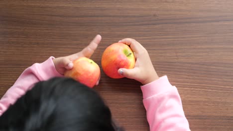 child eating apples