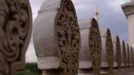 ornate stone carvings on a fence