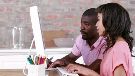 couple using computer together at home