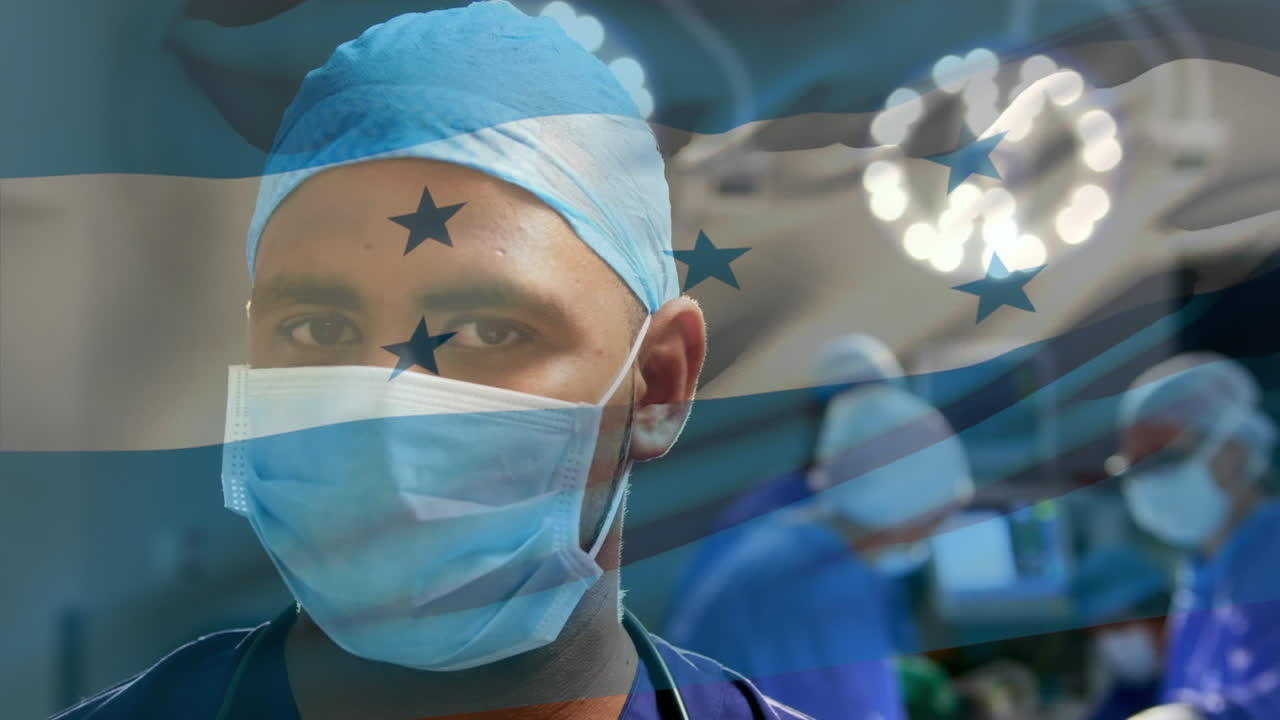ホンジュラス国旗のアニメーションと病院で手術マスクをかぶった二人種の男性外科医の肖像画